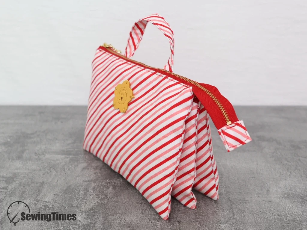 Side view of a handmade 5-pocket organizer pouch