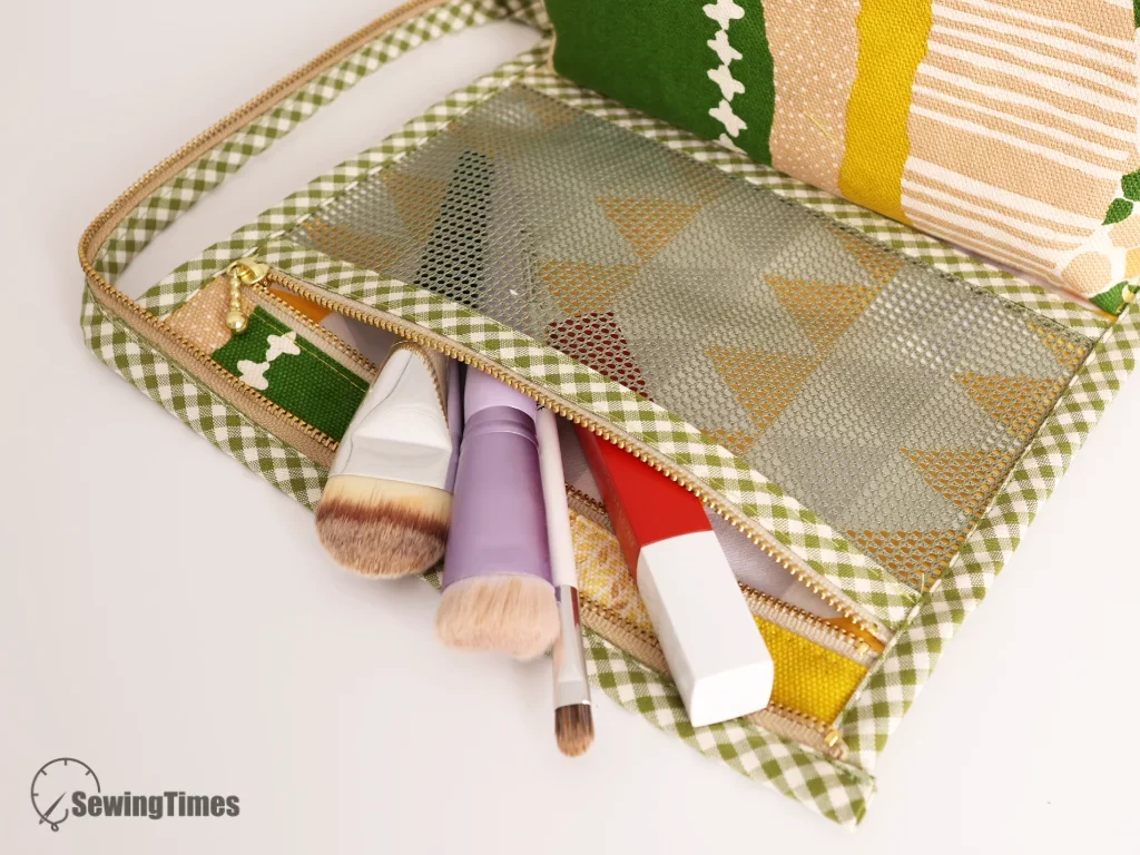 Practical travel organizer roll up pouch filled with makeup brushes and tech cables.