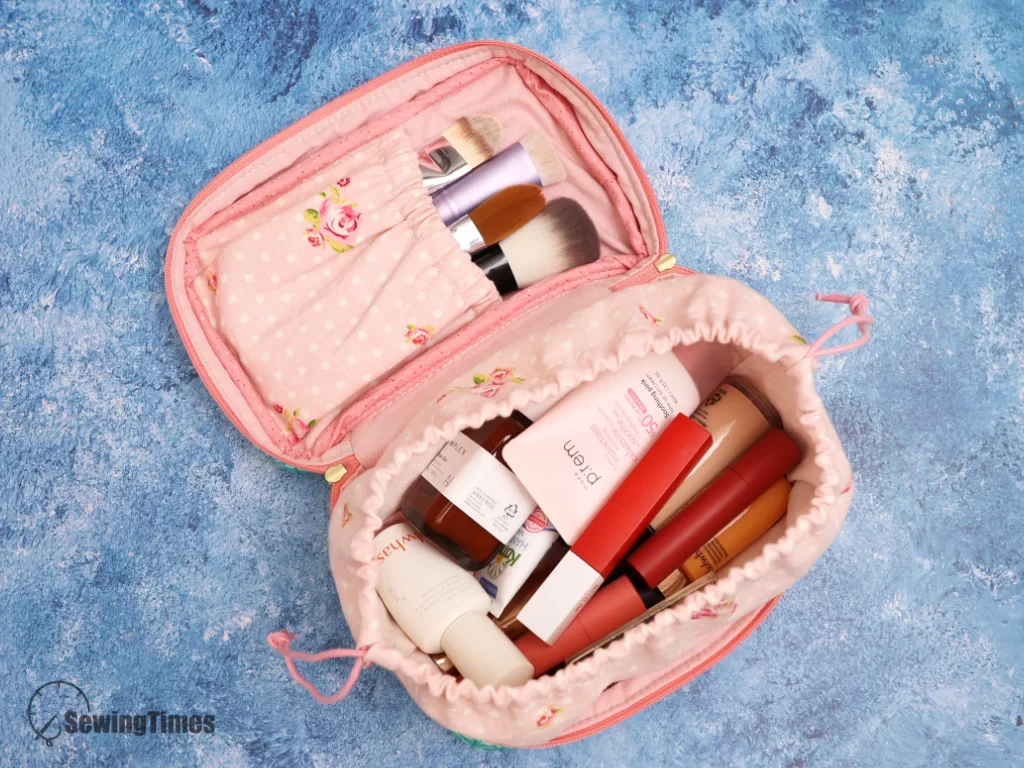 Top-down view of a spacious 2-in-1 makeup bag organized with various skincare bottles, lipsticks, and a separate brush section.