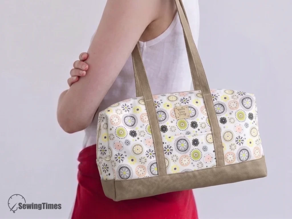A stylish handmade small duffle bag being worn as a shoulder bag, showing its perfect size for daily use.