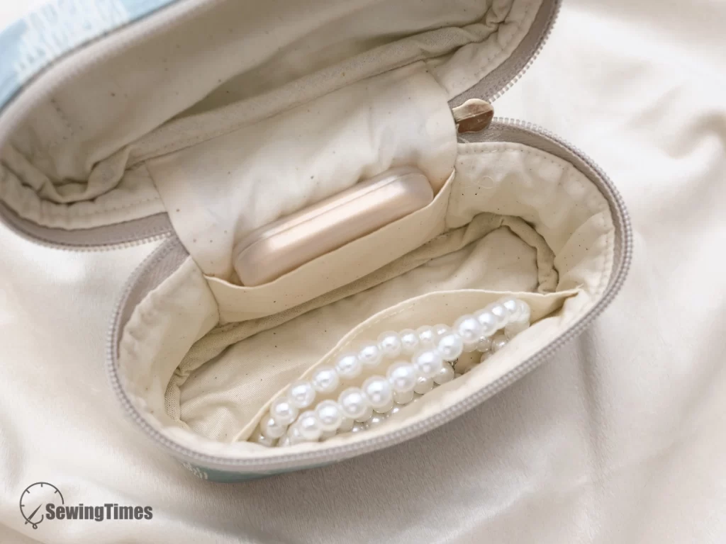 Close-up of the interior lining showing two functional slip pockets for organizing small items.