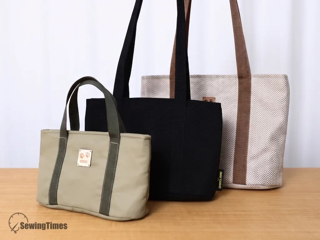 Three finished zipper tote bags in small green, medium black, and large patterned designs, showcasing the versatility of the 3-size sewing pattern.